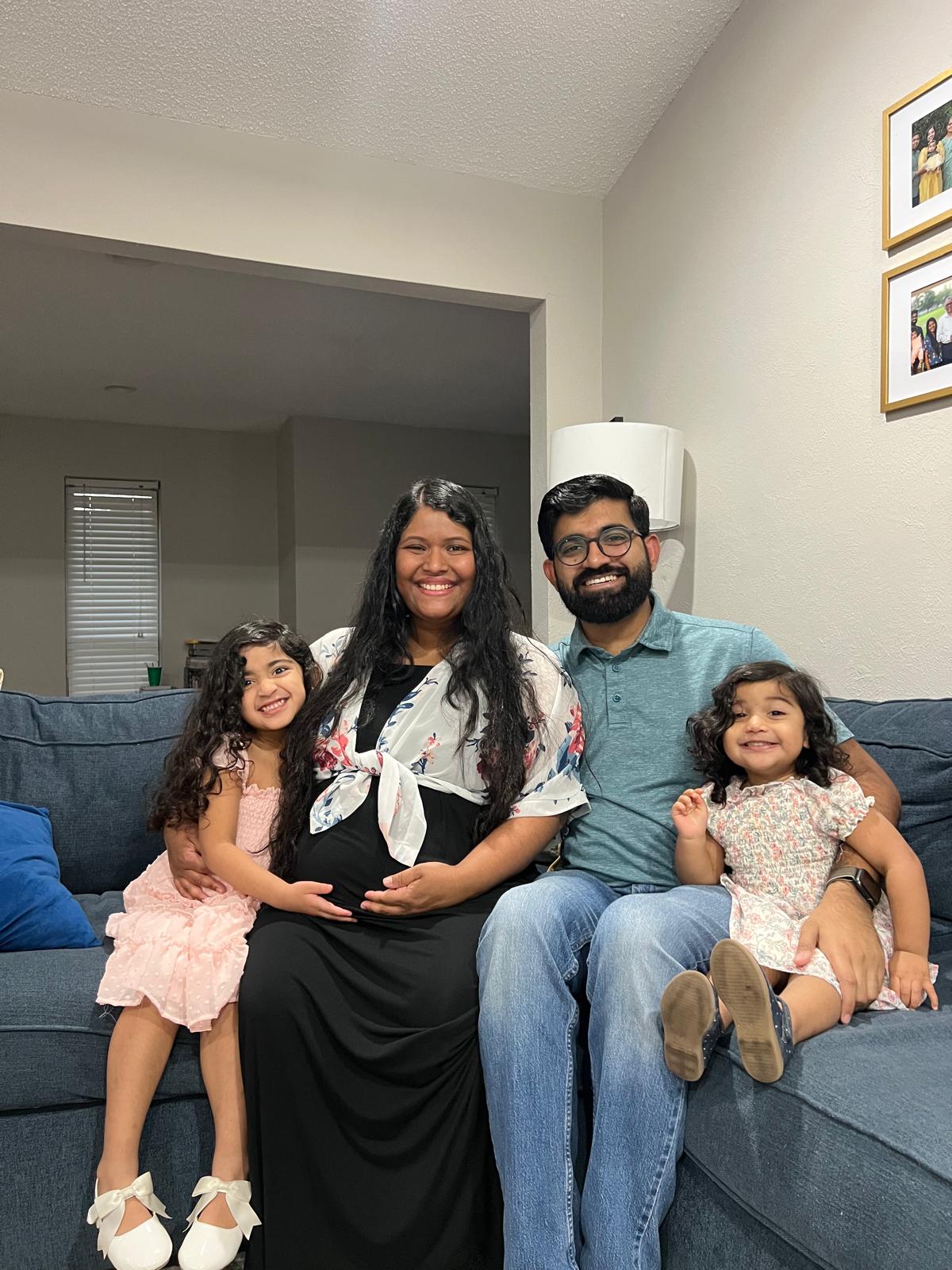 Our family smiling together as we get ready to welcome Baby George